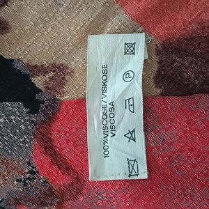 100 percent viscose really soft . Kind of looks like a rose